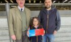 Tom Stewart of sponsors Galbraith, with Steven and Lily Smith, who stood champion and reserve.
