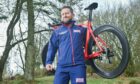 Aberchirder army veteran David Jarvis who is competing in this year's Invictus Games holding his bicycle among woodland