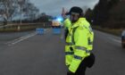 Police at the scene of a crash on at the A96 at McVeigh's near Colpy in January. Image: Jason Hedges/DC Thomson