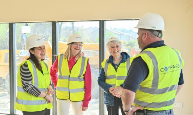 Kate Forbes (left) with  community fundraiser Rhona Matheson and Elsie Normington being shown around The Haven building by site manager Greg Cooper. Image Jason Hedges/DC Thomson