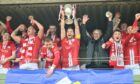 Brechin captain Jamie Bain lifting the Breedon Highland League trophy