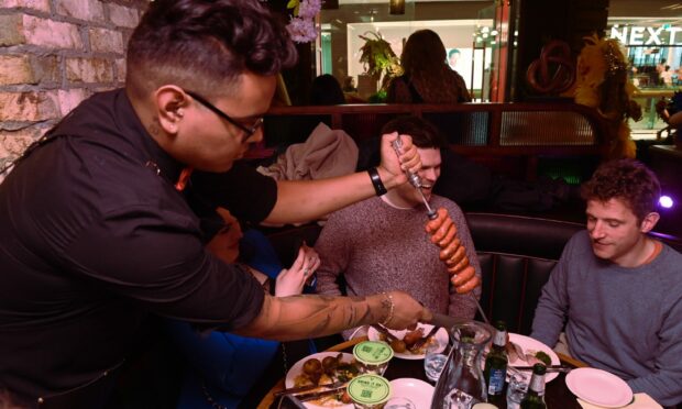 Estabulo uses the Gaucho-style of service, with waiters carving off chunks of meat for hungry diners. Image: Kenny Elrick/DC Thomson