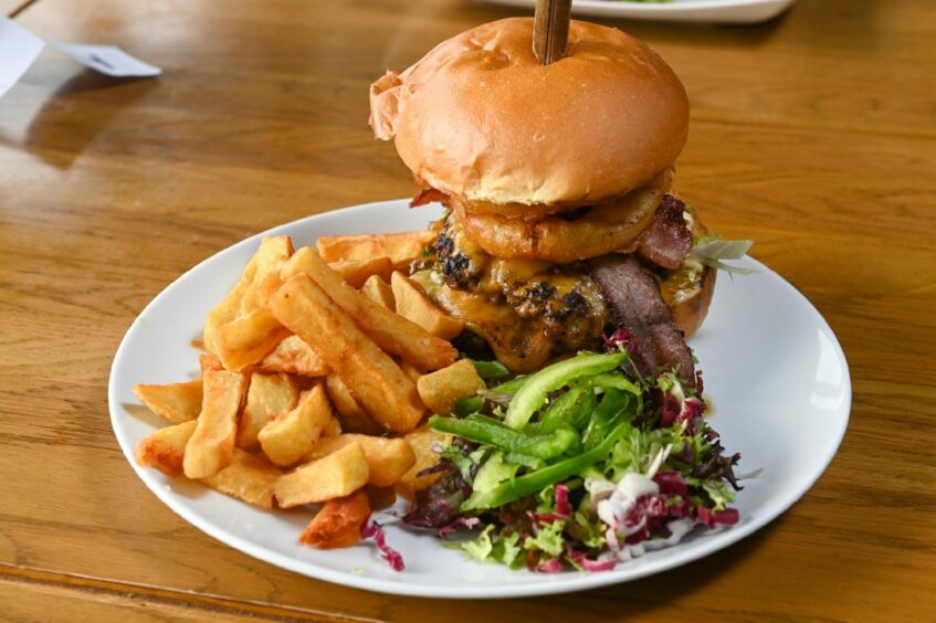 The King of the Hill burger with chunky chips and salad from the feed baron at the westhill golf club.