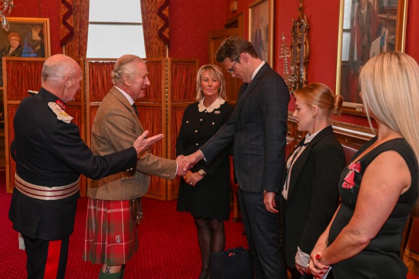 Derek McGowan bows to King Charles, as the monarch visited Aberdeen in October to meet refugees from Afghanistan, Syria and Ukraine that Mr McGowan helped to find homes in the Granite City. Image: Kenny Elrick/DC Thomson.