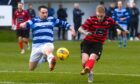 Ali Stark, left, of Banks o' Dee puts pressure on Inverurie Locos' Robert Ward. Pictures by Kenny Elrick and Darrell Benns