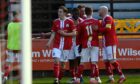 Fraser MacLeod, left, and his Brechin City team-mates celebrate after he scored their second goal against Fraserburgh. Pictures by Kenny Elrick