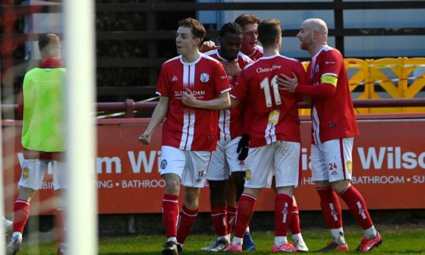 Fraser MacLeod, left, and his Brechin City team-mates celebrate after he scored their second goal against Fraserburgh. Pictures by Kenny Elrick