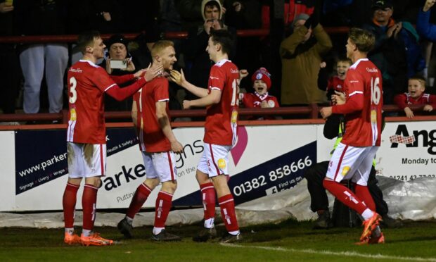 Marc Scott, second from left, celebrates with his team-mates after scoring Brechin's fourth against Fraserburgh. Images: Kenny Elrick