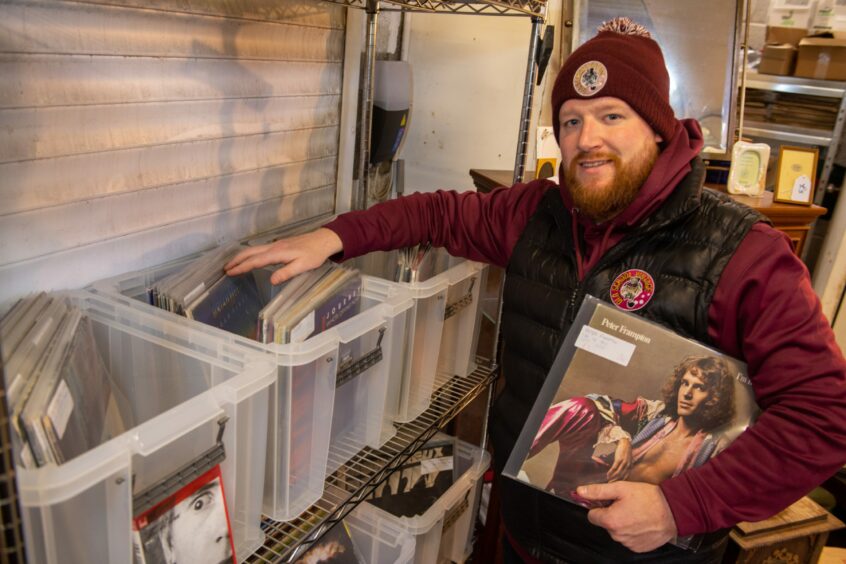Chris shows off the records section at Old School Vintage.