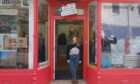 Eilidh Sykes of Beinn Nibheis standing by the shop front in Fort William