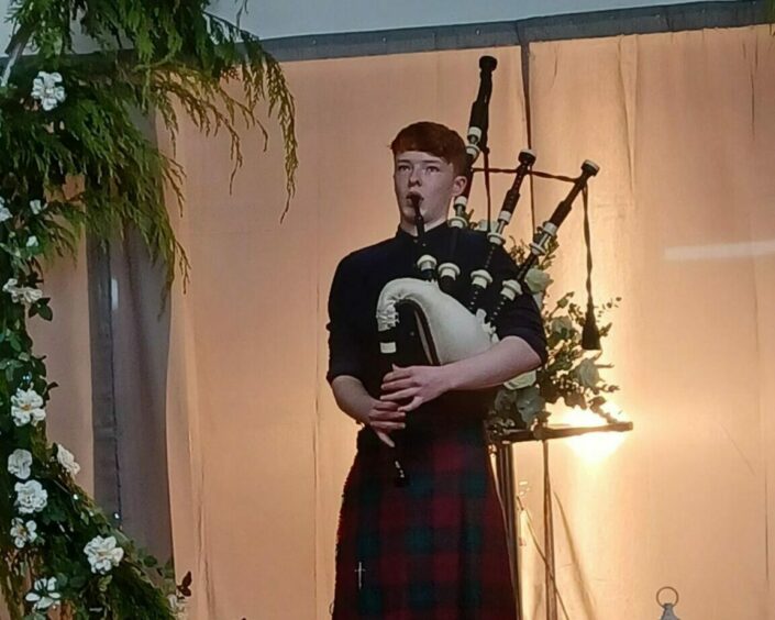 UHI West Highland music student Calum 'Wee Cal' MacAskill performs the bagpipes at the Highland Hospice bridal runway event