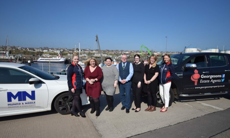 Munro and Noble team with Georgesons Solicitors team.