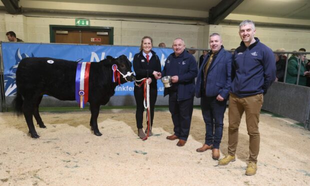 Gina Marshall with her overall champion, sponsors NorthLink Ferries and judge, Gordon Carroll. Image: Ken Amer