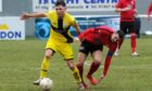 Jack Henry, left, in action for Wick Academy.