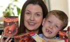 Chloe Woolley with her son Theo and some of the Easter eggs they are donating to Highland Hospice. Image: Sandy McCook/DC Thomson