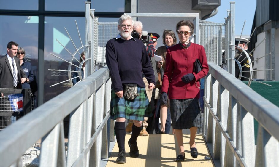 Princess Anne and Andy McKenna walk onto the Corpach Marina after having cut the ribbon and declaring it open.
