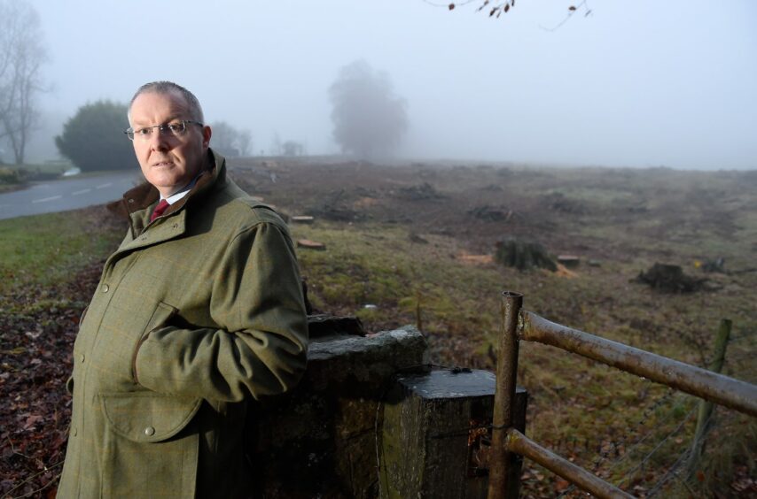 Councillor Duncan Macpherson in a green jacket looking at the camera. he is outside in the countryside.
