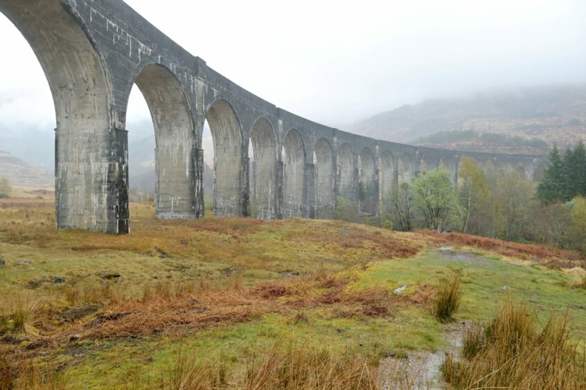 Glenfinnan viaduct on the railway between Fort William and Mallaig and was the first mass concrete bridge to be built in Britain . Barbie would love it, before sorting out uniforms for people.
