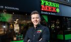 Robbie Moult standing in front of FreshMex's Aberdeen Schoolhill restaurant.