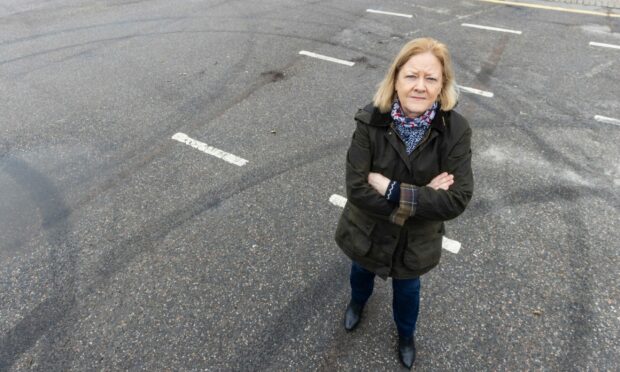 Drivers have caused damage to the Bellfield Car Park in Banchory. Pictured is councillor Ann Ross who is urging residents to report anti-social driving. Image: Scott Baxter/DC Thomson.