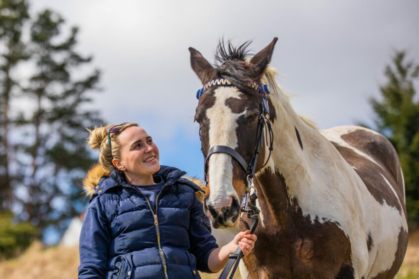 Alisha Murray and her brown and white horse Fee. 