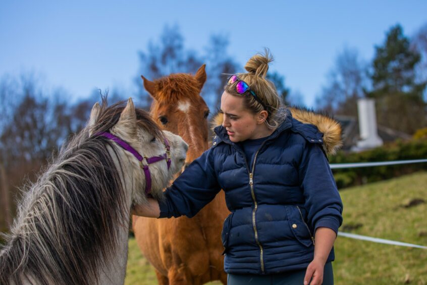 Alisha Murray and horses Sparky (front) and Holly (back). 