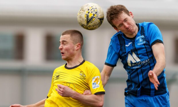 Clachnacuddin's Rorie MacLeod, left, and Strathspey's Daniel Whitehorn contest a header. Pictures by Jasperimage