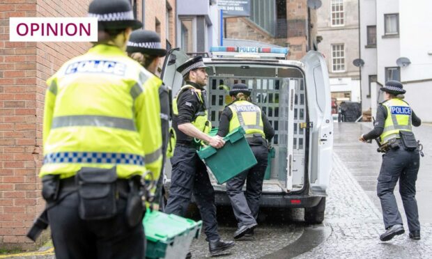 Officers from Police Scotland leave the headquarters of the SNP in Edinburgh with boxes following the arrest of former chief executive Peter Murrell (Image: Lesley Martin/PA)