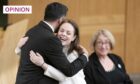 Humza Yousaf hugs Kate Forbes in the main chamber at Holyrood during the vote for Scotland's new first minister (Image: Jane Barlow/PA)