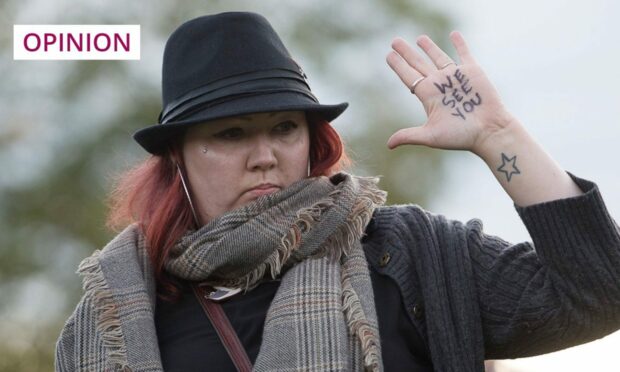 A Scottish protester demonstrates in support of asylum seekers.