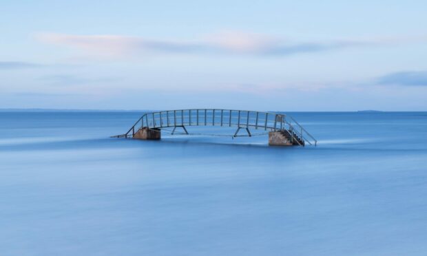 The beautiful Bridge To Nowhere at Belhaven Bay. Image: Kenny Lam, VisitScotland.