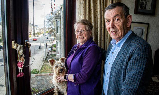 Moira and Jim Mapley, along with their dog Ruby, are having issues with 'boy racers' on Holburn Street. Image: Wullie Marr/DC Thomson.