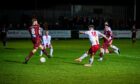 Brechin's Ewan Loudon, number 18, scores their second goal against Keith. Pictures by Wullie Marr