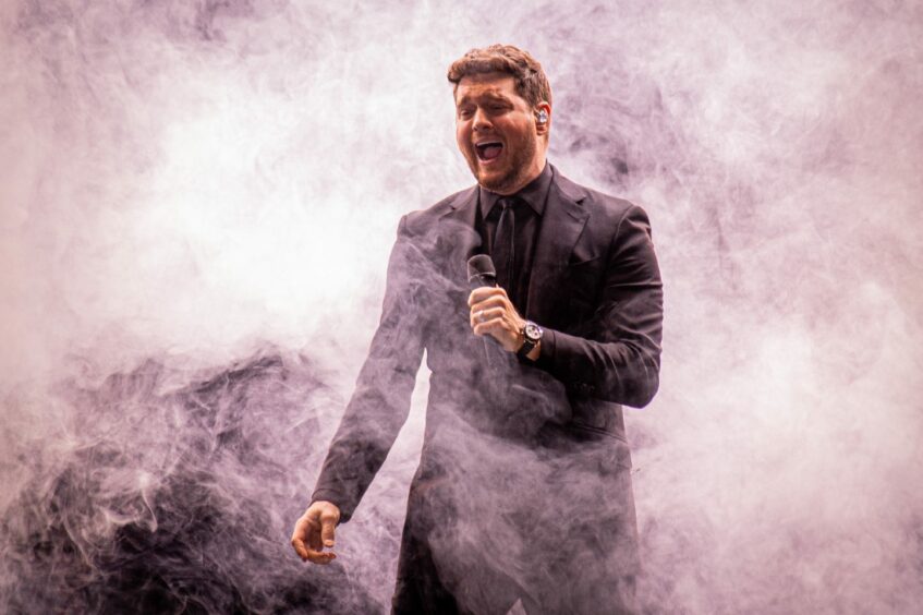 Michael Bublé on P&J Live stage with smoke around him.