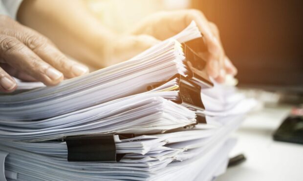 Highland Council used to rack up tens of thousands of pounds on printing meeting papers but has since introduced a ban. Image: Shutterstock