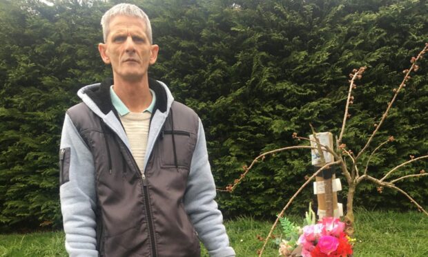 Kevin Balgowan with his late partner's Nicola's memorial tree. Image: Kevin Balgowan.