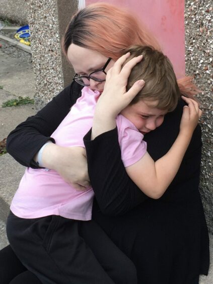 Katherine hugs her son Alfie for the first time after three months at a hospital in Glasgow.