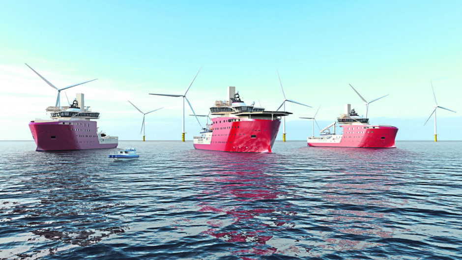 Three large red support vessels in front of seven offshore wind turbines in the North Sea. 