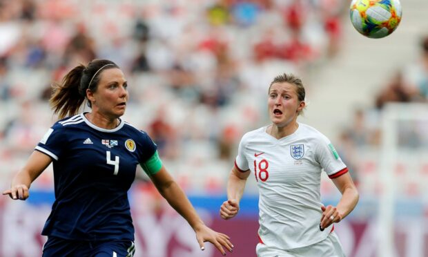 Scotland's Rachel Corsie and England's Ellen White in action at the 2019 World Cup. Image: PA.