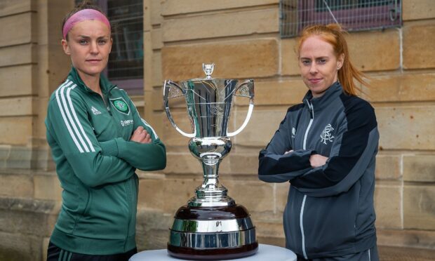 Celtic's Caitlin Hayes, left, and Rangers captain Kathryn Hill, right, pictured with the Scottish Cup trophy ahead of the final. Image: Shutterstock.