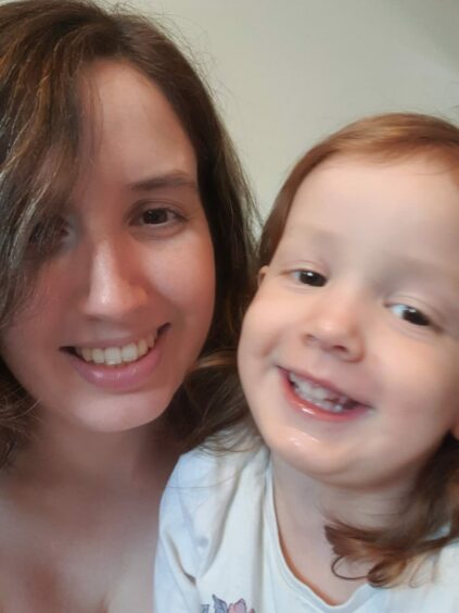 Charli MacVicar with her daughter Jessica smiling for a selfie at their home in Aberdeen.