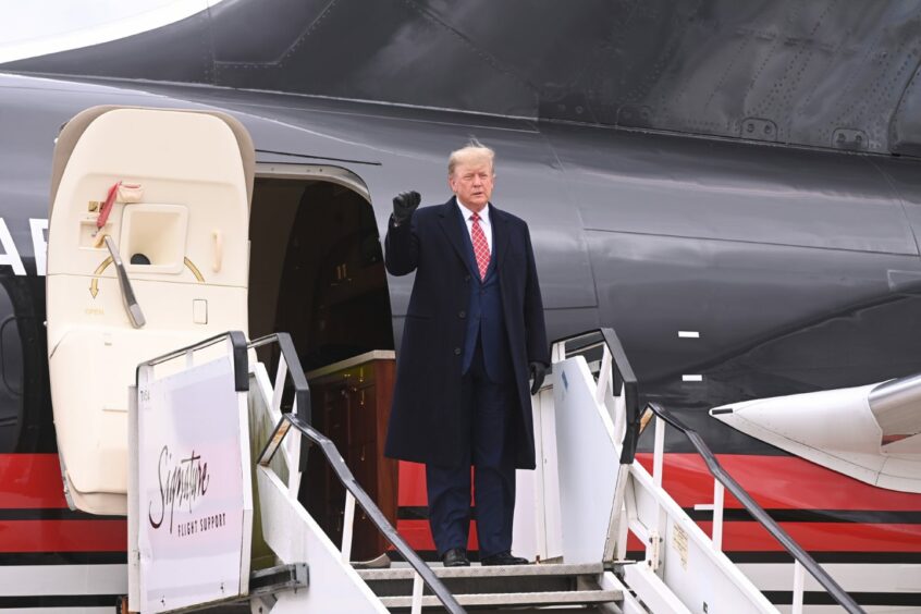 Donald Trump exiting the plane after landing at Aberdeen Airport to visit his golf resort at Balmedie. 