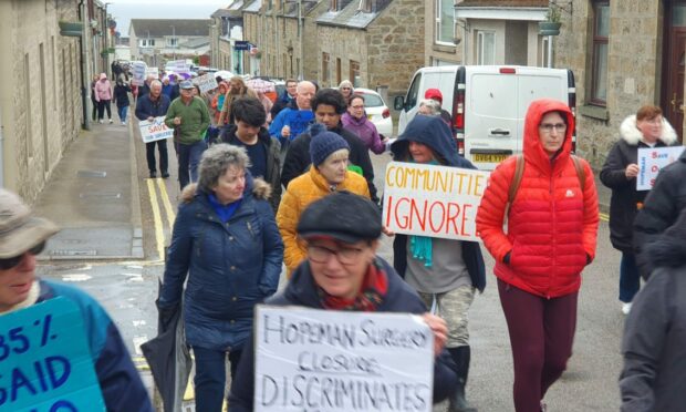 Nearly 100 people marched through the streets of Hopeman to oppose the closures. Image: David Mackay/DC Thomson