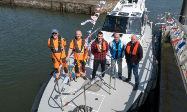 Pilot crew Jim Kidd, Richard Talbert, Darren Murray, Jim McDonough and Bryan Robbie at Montrose Port. Image: Paul Reid