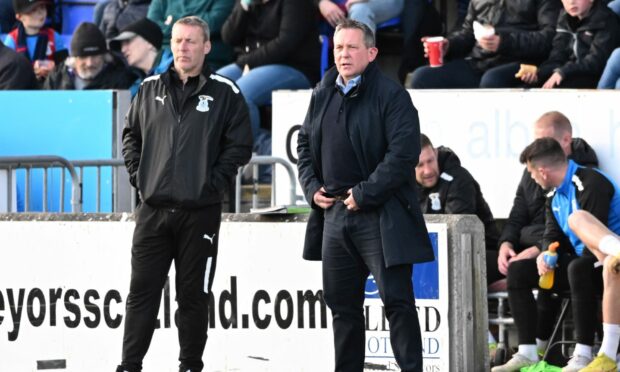 Inverness head coach Billy Dodds, right, and coach Barry Wilson watch on from the sidelines. Images: Paul Devlin/SNS Group