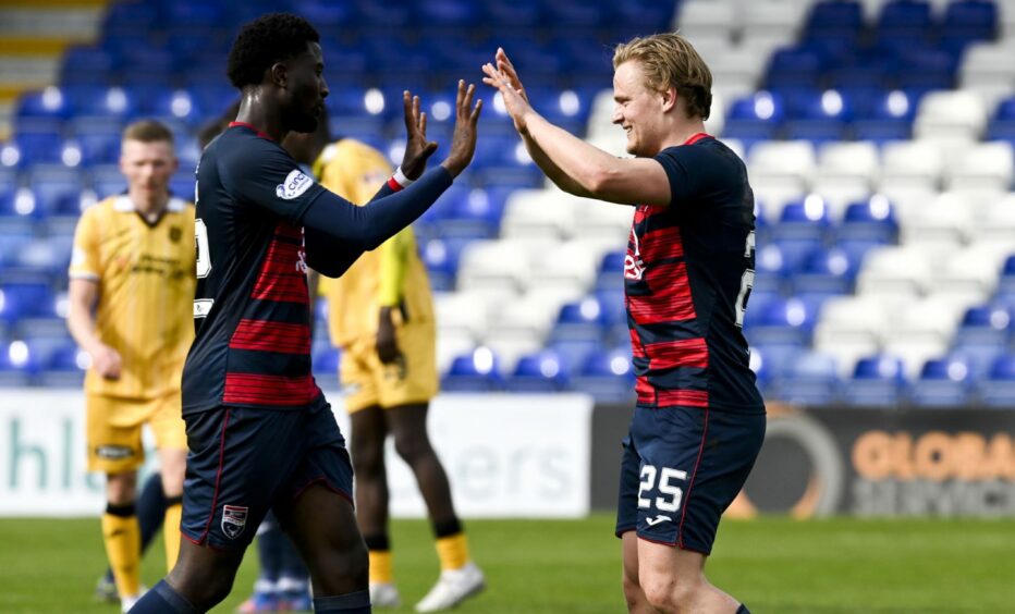 Alex Samuel celebrates with Nohan Kenneh after Ross County's win over Livingston.