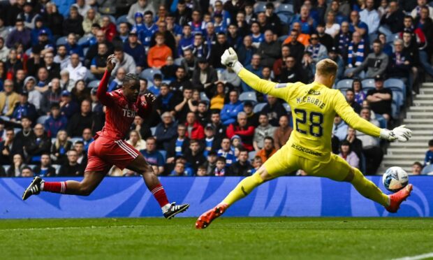 Rangers' Robby McCrorie makes a save to deny Aberdeen's Duk at Ibrox. Image: SNS.