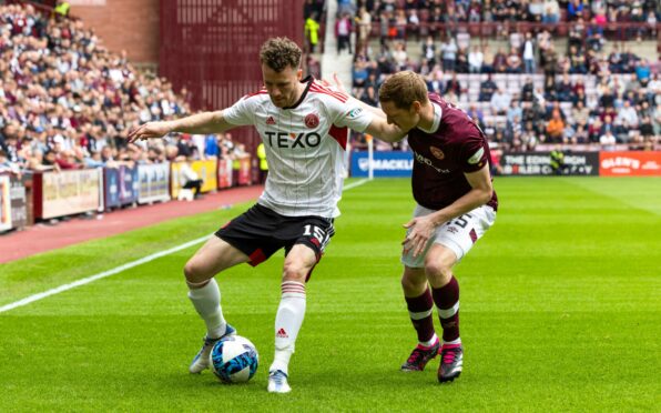 Aberdeen's Marley Watkins and Kye Rowles in action at Tynecastle. Image: SNS