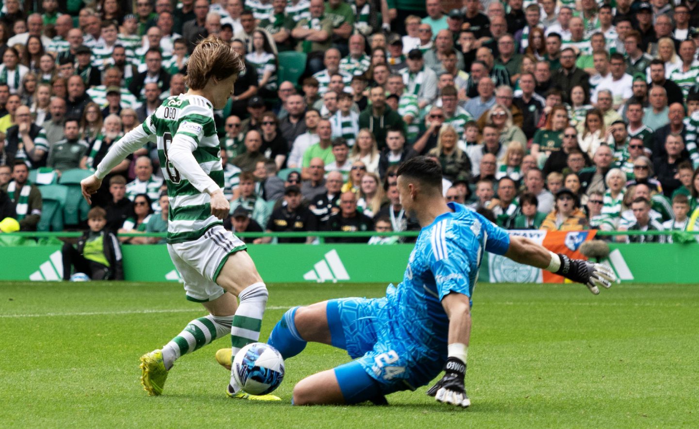 Celtic's Kyogo Furuhashi goes down under a tackle from Kelle Roos. 