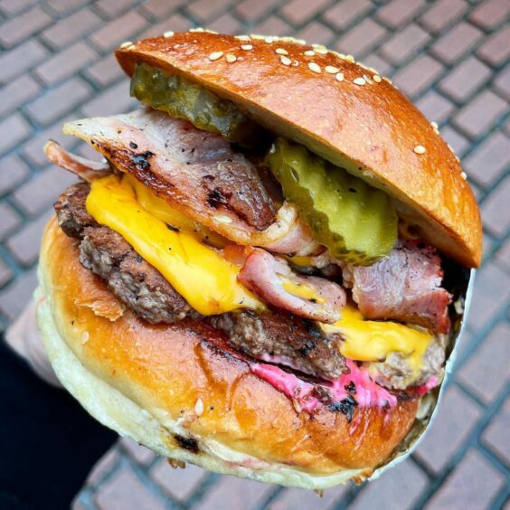 An Aberdam burger with cheese, bacon and pickles